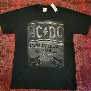 AC/DC band t-shirt. New, never worn. There is no design on the back side.